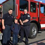 Left, Isaac Rico arrived to his first day of third grade at Oak Harbor Elementary on Sept. 9 escorted by North Whidbey Fire and Rescue firefighters Michael Pelzer and Jonathan Walker. Ricos father, Tyler Rico, worked with the fire district for seven years and passed away at the end of August.