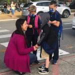 Photo by Emily Gilbert/Whidbey News-Times
ReKann Brannon cheers up here three sons, Hayes, who is going into fourth grade, Johnny, who is going into third grade, and Owen, who is going into first grade, before their first day of school at Oak Harbor Elementary on Sept. 9.
