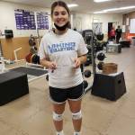 Oak Harbor High School junior Mia Carman broke a school record in the trap bar dead lift this summer while she trained for volleyball season.