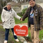 Photo provided
Carol and Bob Wall display a Kindness is Contagious sign from the campaign they founded to promote civil discourse.