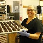 Mona Newbauer holds a tray of chocolates. (Photo by Kira Erickson/South Whidbey Record)