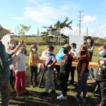 Photo by Karina Andrew/Whidbey News-Times
Farmer Kylie shows a third grade class the parts of a tomato plant.