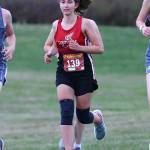 Coupeville's Helen Strelow finished in first place in the girls race
with a time of 24:56, 3 seconds ahead of her opponent, Maddy Nielsen of
Mt. Vernon Christian.  Coupeville also won the girls' team title