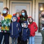 Photo by Karina Andrew/Whidbey News-Times
Michael and Janette Boone, volunteer Sue Hosmer, and the six Boone children attend the formal dedication of their Habitat for Humanity home.