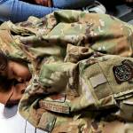 U.S. Air Force Photo
An Afghan child sleeps on the cargo floor of a U.S. Air Force C-17 Globemaster III, kept warm by the uniform of the C-17 loadmaster during an evacuation flight from Kabul, Afghanistan, Aug. 15, 2021.