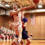 Photo by John Fisken
Coupeville High School senior Hawthorne Wolfe jumps for the hoop during a game against island rival Oak Harbor Wednesday. Coupeville came back from a 10-point deficit to win the first game of the year 70-64.