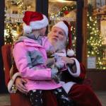 Photo by Karina Andrew/Whidbey News-Times
Lauren Vasileff, age 9, tells Santa what she wants for Christmas this year.