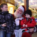 Photo by Karina Andrew/Whidbey News-Times
August Stohmire, 2, and his young uncle Ryan Brown, 9, meet Santa Claus Dec. 4. on Pioneer Way.