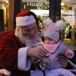 Photo by Karina Andrew/Whidbey News-Times
Noelle Hallquist, 16 months, sits on Santas lap Dec. 4 on Pioneer Way.