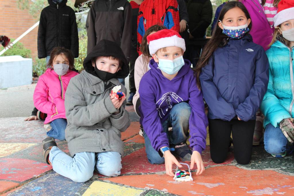 Photo by Karina Andrew/Whidbey News-Times
Gabriel Kazmierczak, front left, shows off his winning dogsled.