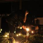 Photo by Karina Andrew/Whidbey News-Times
Visitors light their candles in the center of the spiral.