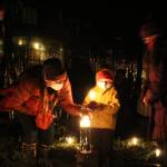 Photo by Karina Andrew/Whidbey News-Times
Visitors light their candles in the center of the spiral.