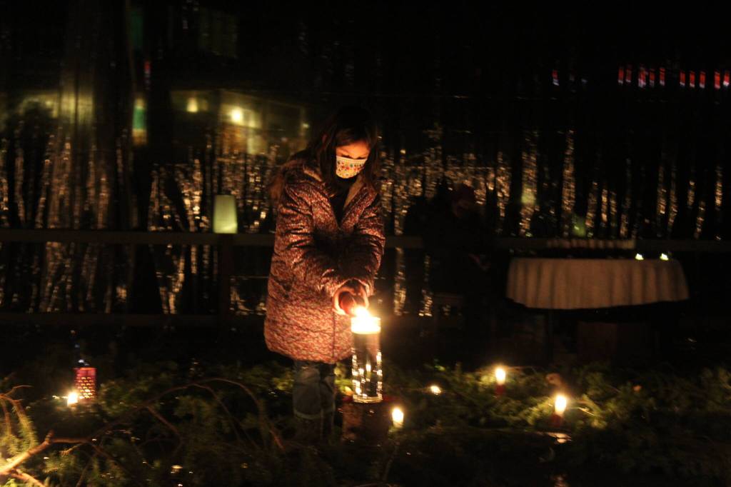 Photo by Karina Andrew/Whidbey News-Times
Visitors light their candles in the center of the spiral.