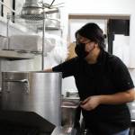 Photo by Karina Andrew/Whidbey News-Times
Michelle Dalrymple prepares food in the Fare Market kitchen.