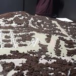 Museum volunteer Brent Babcock demonstrates the night vision goggles. The interactive exhibit reopened in January after being closed because of COVID-19. (Photo by Sonny Starks)