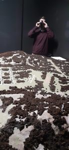 Museum volunteer Brent Babcock demonstrates the night vision goggles. The interactive exhibit reopened in January after being closed because of COVID-19. (Photo by Sonny Starks)