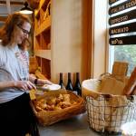 Photo by Kira Erickson/South Whidbey Record
Hannah McCabe, the manager of Seabiscuit Bakery, grabs a gougère to serve.