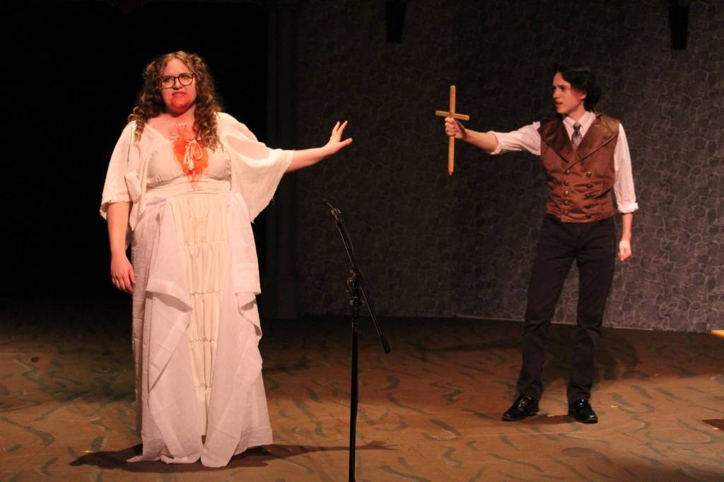 Alora Van Auken, left, and A.J. Gibson rehearse in their roles of Lucy Westenra and Dr. Abraham Van Helsing for Oak Harbor High Schools upcoming production of Dracula.