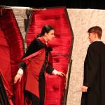 Count Dracula, played by Zoe Eisenbrey, emerges from his coffin to confront Jonathan Harker, played by Spencer Grubbs.