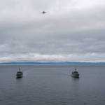 Photo by Petty Officer 2nd Class Steven Strohmaier
A U.S. Navy P-8 Poseidon Naval Air Station Whidbey Island aircraft flies over U.S. Coast Guard Cutter Blue Shark and U.S. Coast Guard Cutter Osprey as they transit alongside HMCS Saskatoon and HMCS Yellowknife from the Royal Canadian Navy during a joint exercise in the Salish Sea on Feb. 17.