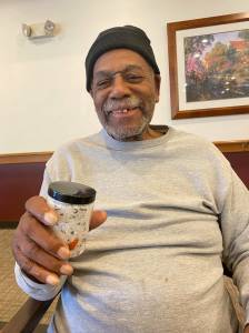 Resident Lorenzo Reid Sr. displays a jar of homemade epsom salt bath soak. (Photo provided)