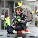 An Oak Harbor kid rides on a Pacific Northwest Naval Air Museum float.