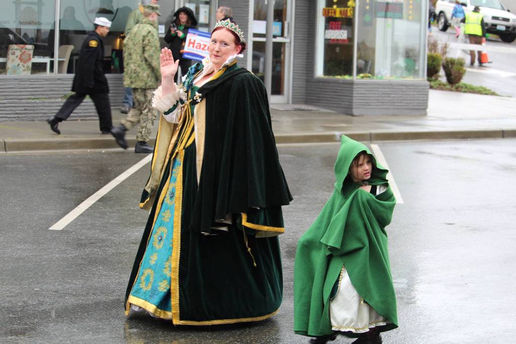 An Oak Harbor queen and princess walk in the parade.