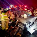 Firefighters extricate an injured driver from her vehicle after a four-car accident March 17. (Photo provided)