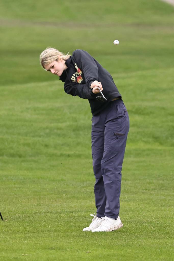 Photo by John Fisken
Senior Caitlin Sullivan follows through with a shot.