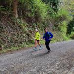 Riley Nachtrieb, left, runs the last mile of the Whidbey Island Traverse accompanied by Herman Meyer. (Photo provided)