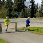 Riley Nachtrieb, left, runs through Freeland accompanied by her pacer, Troy Haeseler. (Photo provided)