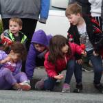 Kids scramble for candy thrown by parade participants. (Photo by Karina Andrew/Whidbey News-Times)