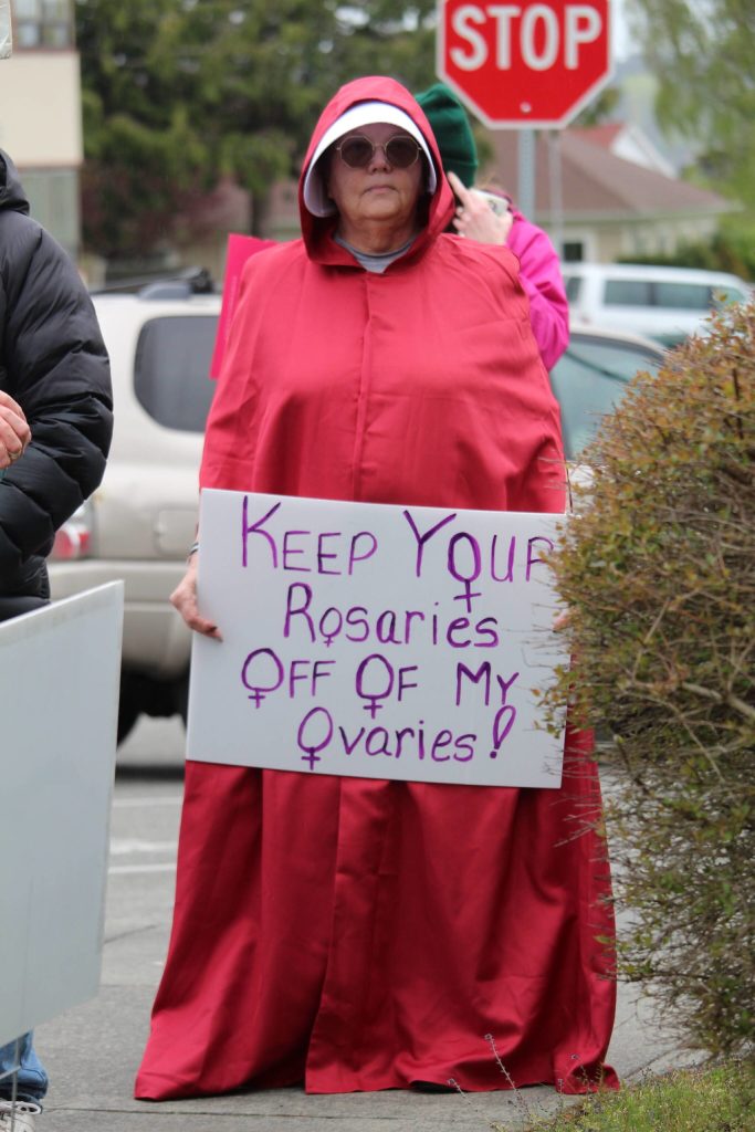 A Whidbey resident dresses as a handmaid from Margaret Atwoods dystopian The Handmaids Tale. (Photo by Karina Andrew/Whidbey News-Times)