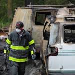 Firefighters investigate at the scene of a North Whidbey residential fire Thursday morning. (Photo by Karina Andrew/Whidbey News-Times)