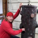Casey Strelecki designed a donation box in the form of a tree stump adorned by a woodpecker. (Photo by Karina Andrew/Whidbey News-Times)