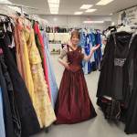 Patty Folkestad with prom dresses. (Garage of Blessings Facebook)