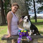 Maryah Love sits with a dog she handles and ribbons she won. (Photo by Mary Edwards)