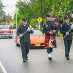 Central Whidbey Fire and Rescue Captain Jerry Helm plays bagpipes down the parade route. (2016 File Photo by Pam Headridge.)