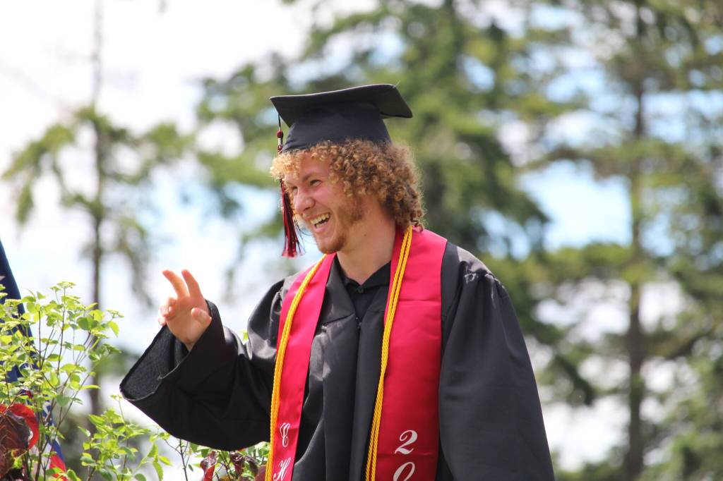 Photo by Karina Andrew/Whidbey News-Times
Graduate Caleb Meyer grins on his way off the stage after receiving his diploma.