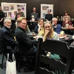 Photo by Billy Tierney
Playwright Liza Powel OBrien, center, sits beside her celebrity husband Conan at an opening night party for Apostrophe.
