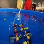 Solomon Hilliard, 13, flies a remotely operated vehicle made by Etta Cameron, 12 and Maisie Pendell, 12. (Photo by David Welton)