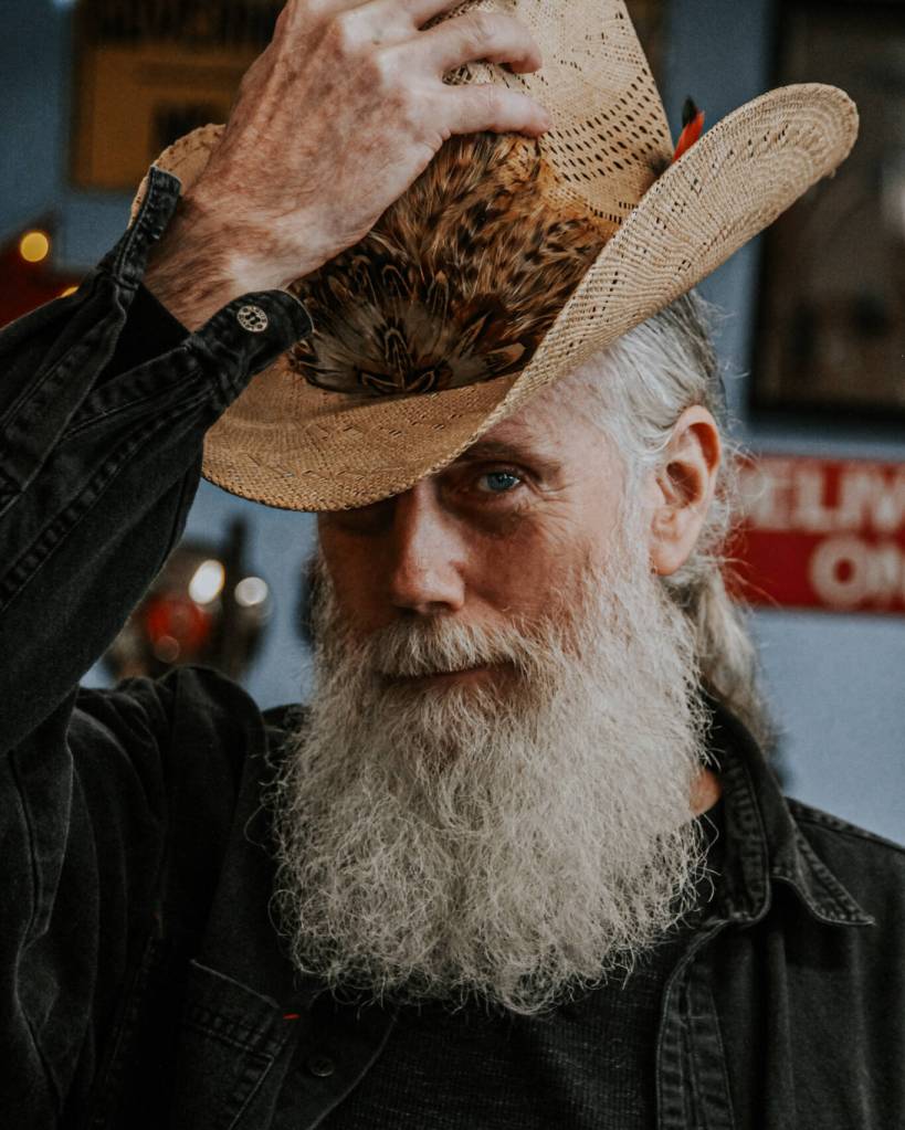 Man in the Straw Hat by Alex Merrill.