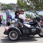 A member of the VFW rides through the Oak Harbor Fourth of July parade on a motorcycle.