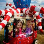 Westin and Macklin ride in an octopus contraption during the Maxwelton Independence Day Parade.