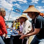 Photo by David Welton
The Blue Heron Canoe Family pulls a canoe up onto the beach after arriving at Sandy Point on Whidbey Island.