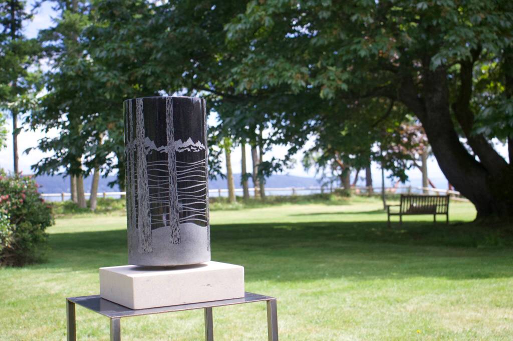 A piece by renowned stone sculpture artist Sue Tavis is displayed outdoors at Willows Orchard.