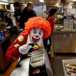 Deano the Clown tries a spoonful of pickles at the galley on a ferry running the Mukilteo-Clinton route.