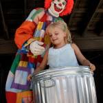 Deano the Clown places a child in an empty trashcan during a previous show at the Whidbey Island Fair. (Photo by David Welton)