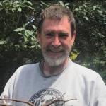 Daniel Gregory gathers burdock root for his wife, Lori Kane's herbalism studio. (Photo provided)