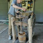 Photo by Kira Erickson/South Whidbey Record
South Whidbey picker John Norris demonstrates how to use an old fruit press he found while exploring a family farm. He has plans to donate the artifact to the South Whidbey Historical Society, which will put it on display for fairgoers to see this year.